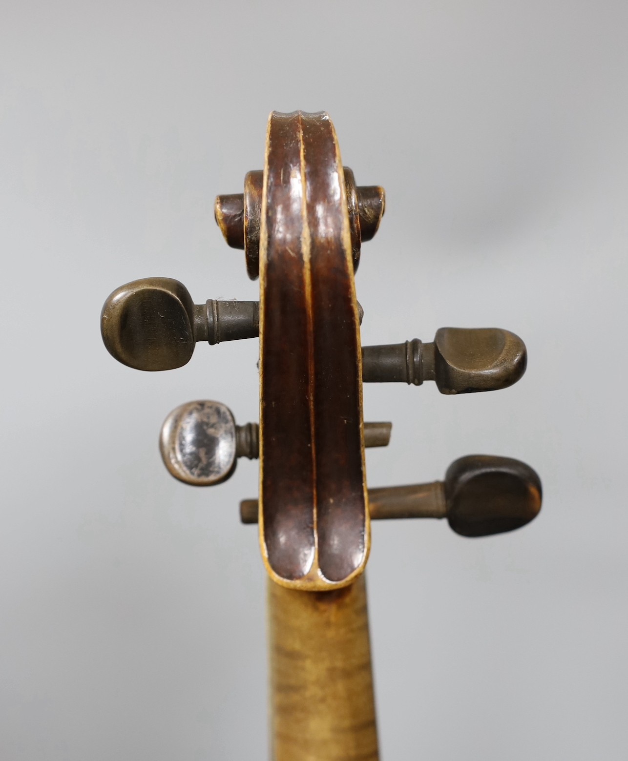 A cased German violin, labelled Stradivarius and dated 1886, back measures 36cm excl button